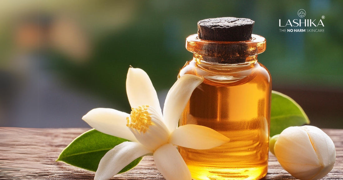 Close-up of orange blossoms and neroli oil in a glass bottle showing significance of neroli for its refreshing and skin-nourishing properties.